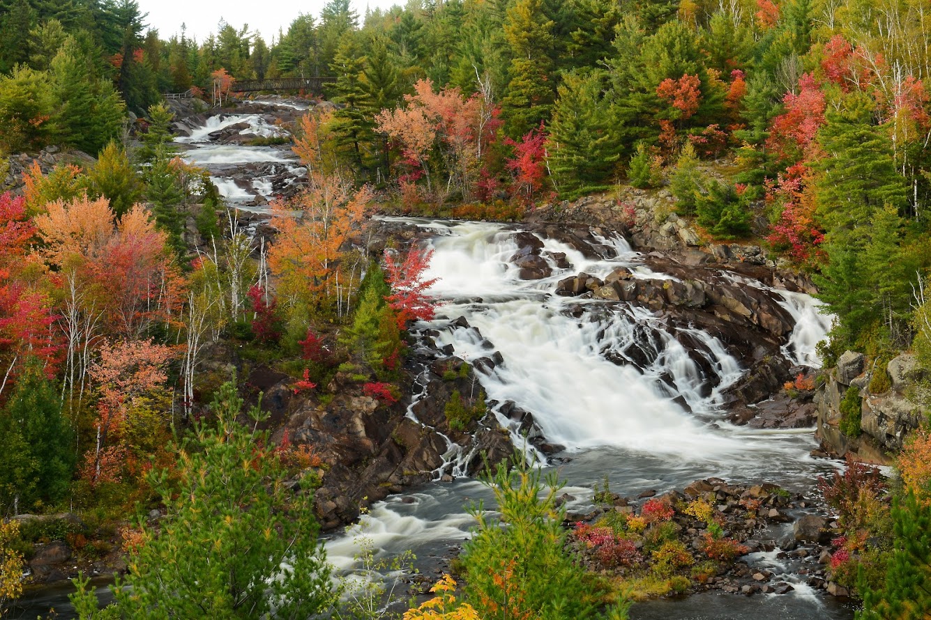 Onaping Falls waterfall with colourful fall trees